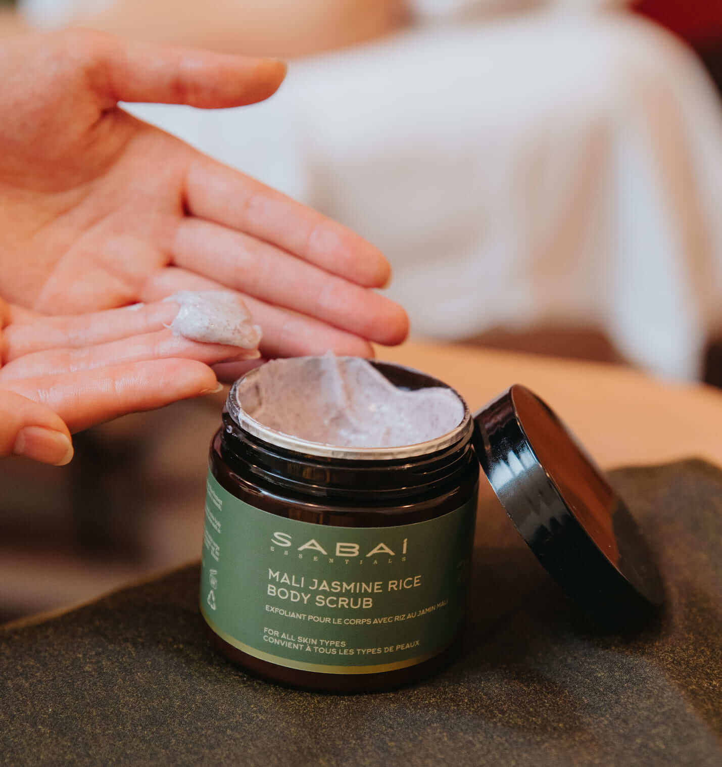 a small bottle of Mali Jasmine Rice Body Scrub