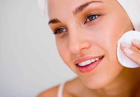 Cotton pad model woman face, cosmetology remover makeup, clear. Beautiful blonde woman removing makeup from her face skin